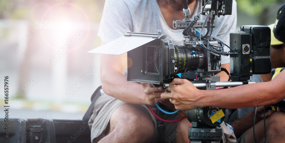 Behind the scenes of movie shooting or video production at outdoor