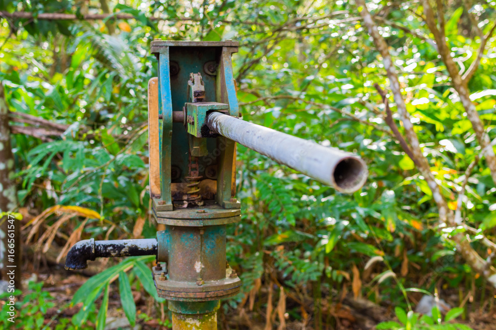 Blue water pressure pump column for water supply from well Stock Photo