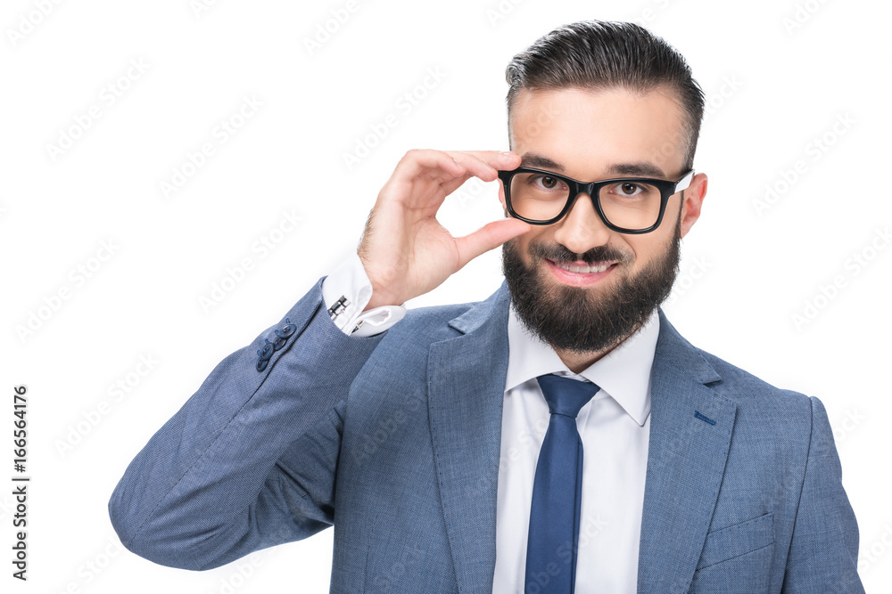 handsome businessman in grey suit and eyeglasses looking at camera, isolated on white handsome businessman in grey suit and eyeglasses looking at camera, isolated on white