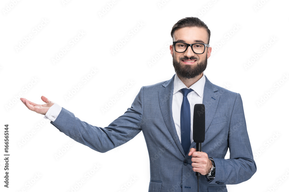 handsome smiling male journalist with microphone presenting something, isolated on white handsome smiling male journalist with microphone presenting something, isolated on white
