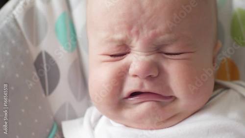 little baby starting to cry. the child is going to cry.