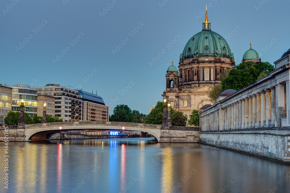 The Berlin cathedral at the banks of the river Spree at dusk