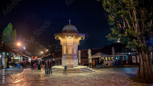 SARAJEVO, BOSNIA AND HERZEGOVINA - May 1 2014: Sebilj fountain on Bascarsija square in Sarajevo. Bosnia and Herzegovina
