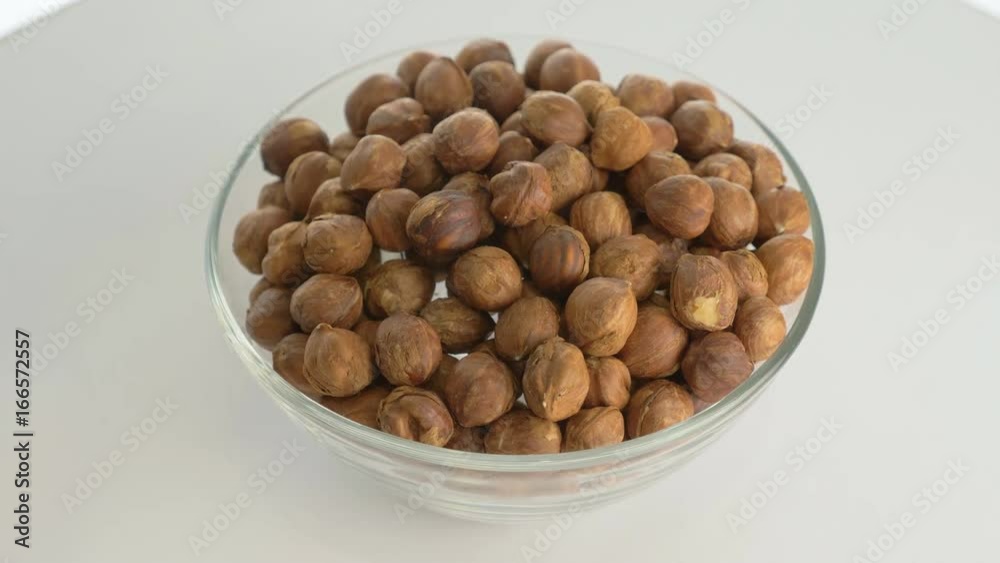 The nut hazelnut rotates on the turntable. The nut hazelnut rotates on the turntable.