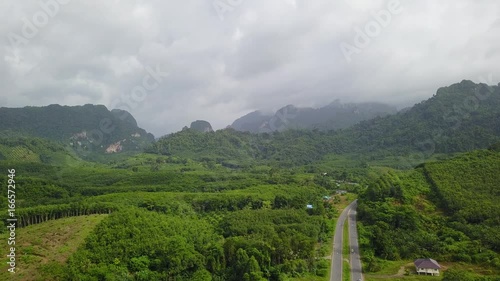 Mountain hills, tropical forest and road, silance photo