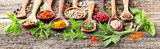 Spices and herbs on a wooden board