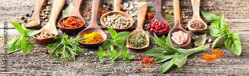 Spices and herbs on a wooden board
