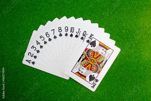 set of play card on green table