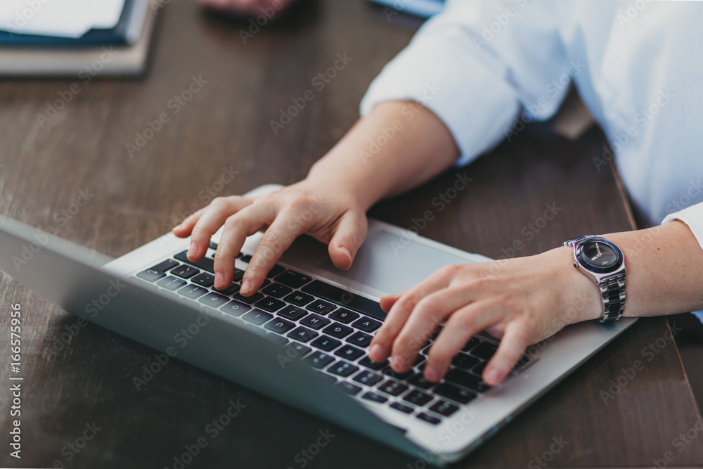Woman's hands typing on keyboard Woman's hands typing on keyboard