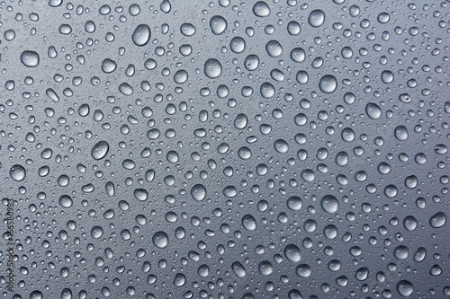 abstract water drops on a silver background.water drops on dark metal background