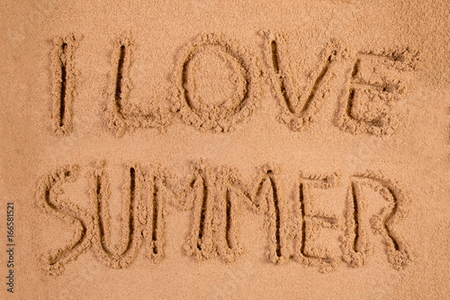 I Love Summer written in soft wet sand on a beach