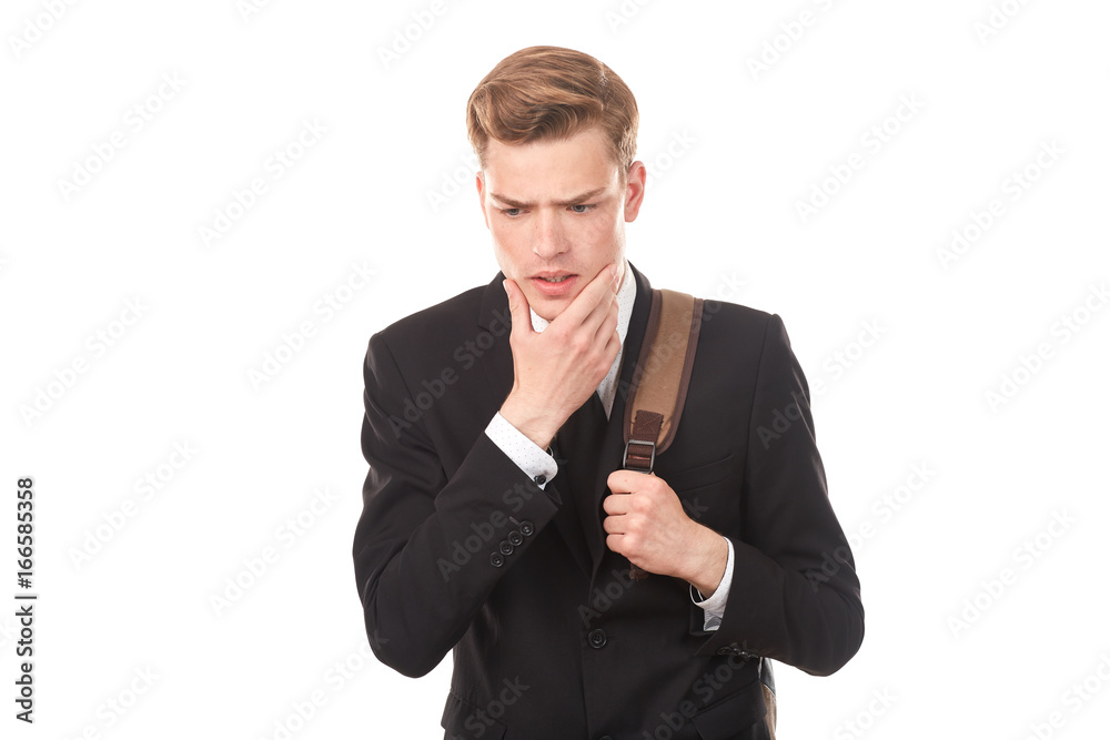 Studio portrait of teenage college student in black suit posing against white background Studio portrait of teenage college student in black suit posing against white background