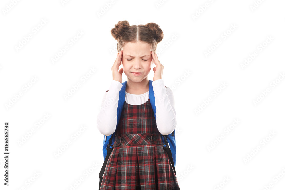 Portrait of girl in school uniform with backpack suffering from headache against white background Portrait of girl in school uniform with backpack suffering from headache against white background