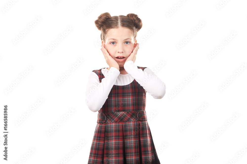 Portrait of scared girl in school uniform against white background