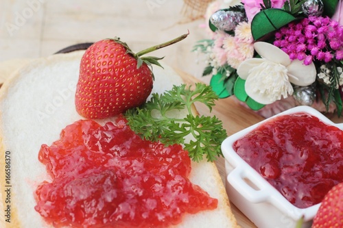 Strawberry jam with slice of bread delicious