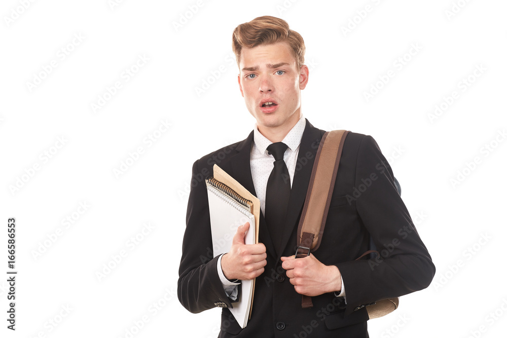 Studio portrait of teenage college student in black suit posing against white background Studio portrait of teenage college student in black suit posing against white background