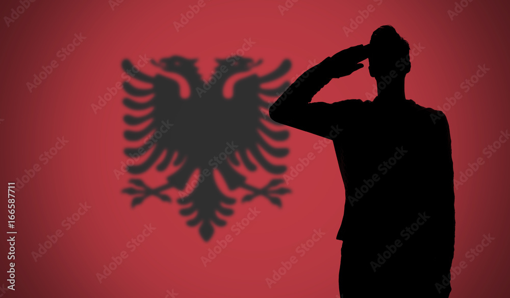 Silhouette of a soldier saluting against the albania flag