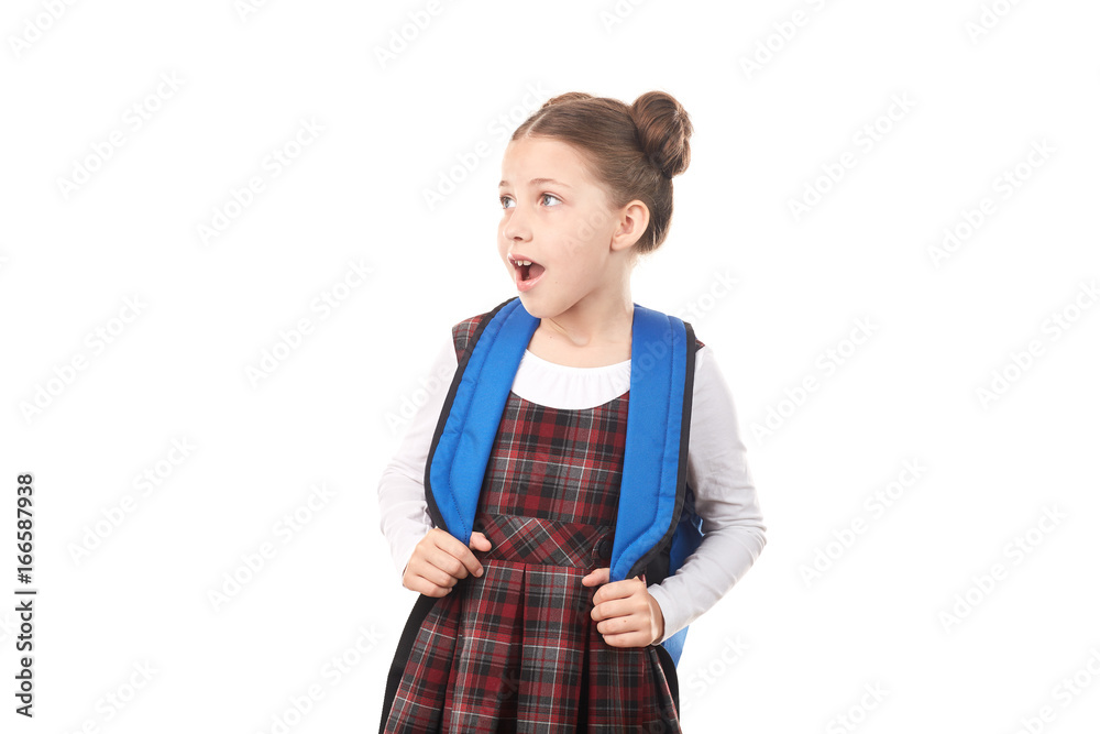 Portrait of shocked girl in school uniform with backpack against white background Portrait of shocked girl in school uniform with backpack against white background