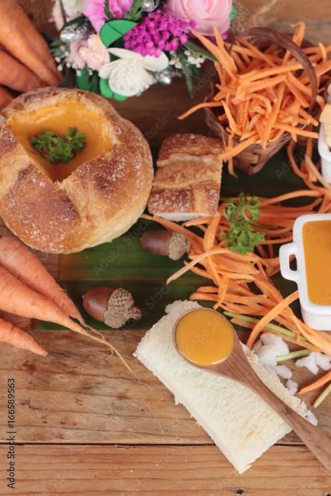 Fototapeta premium Carrot cream soup with bread is delicious