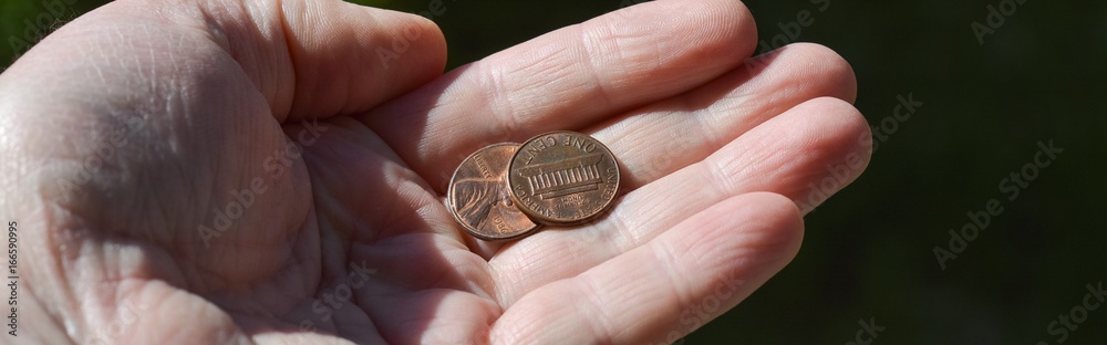 Outstretched hand with coins, poverty Outstretched hand with coins, poverty