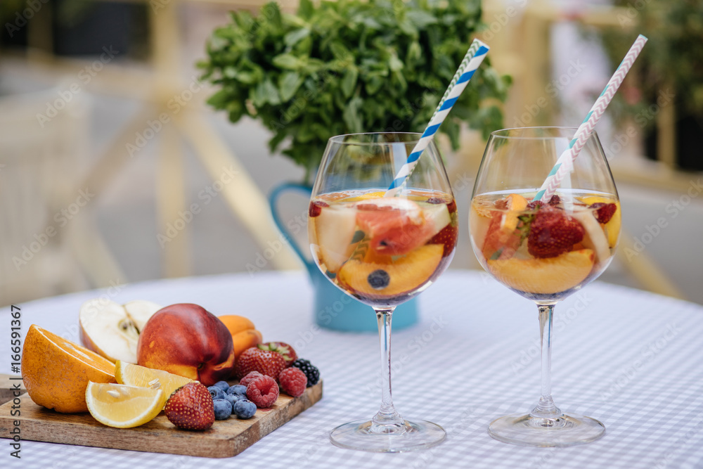 Delicious Red Sangria with fruits on table Delicious Red Sangria with fruits on table