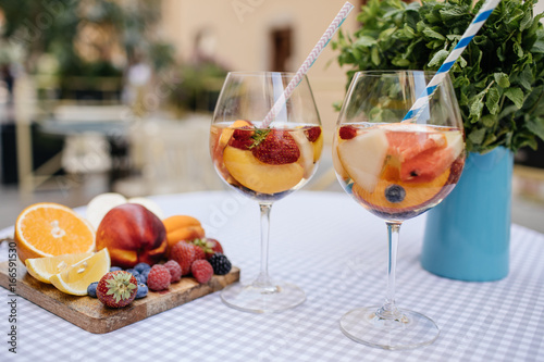 Delicious Red Sangria with fruits on table