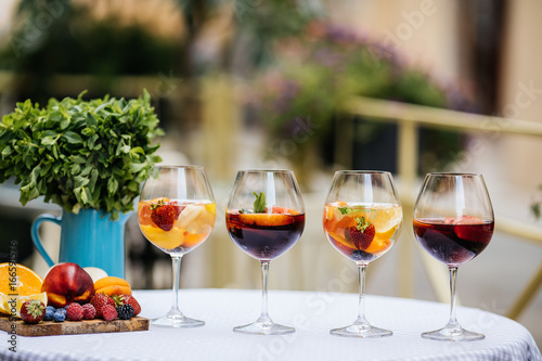 Delicious Red Sangria with fruits on table