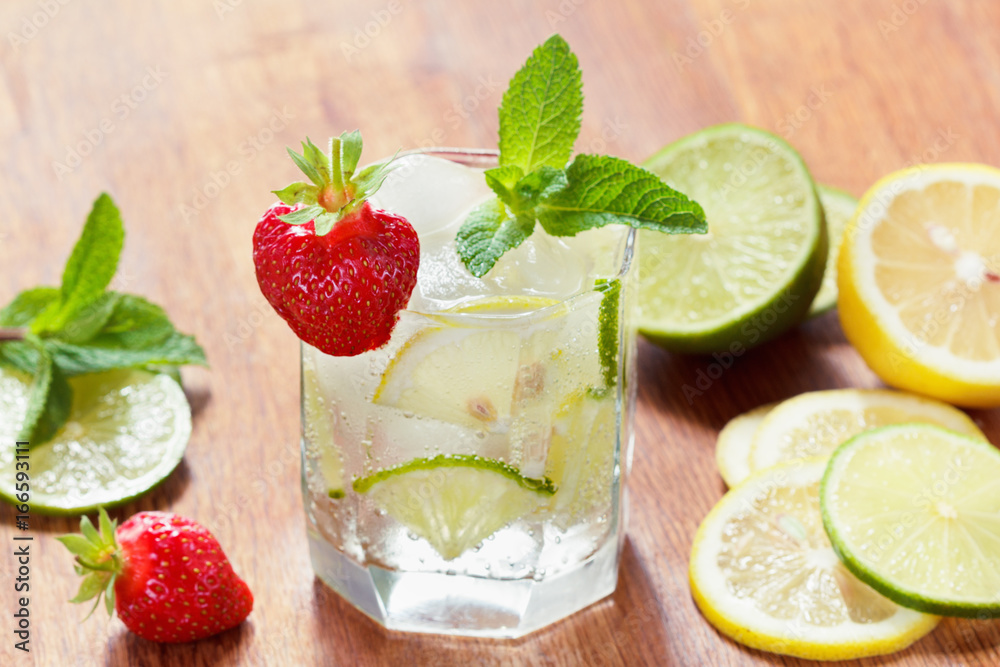 Refreshing summer drink with Strawberry in glasses on the wooden table Refreshing summer drink with Strawberry in glasses on the wooden table