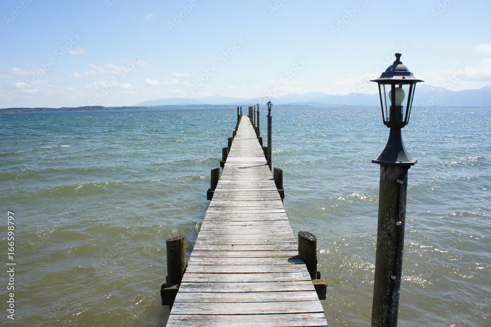 small old wood bridge with lamp wave bay landscape mountain view in summer