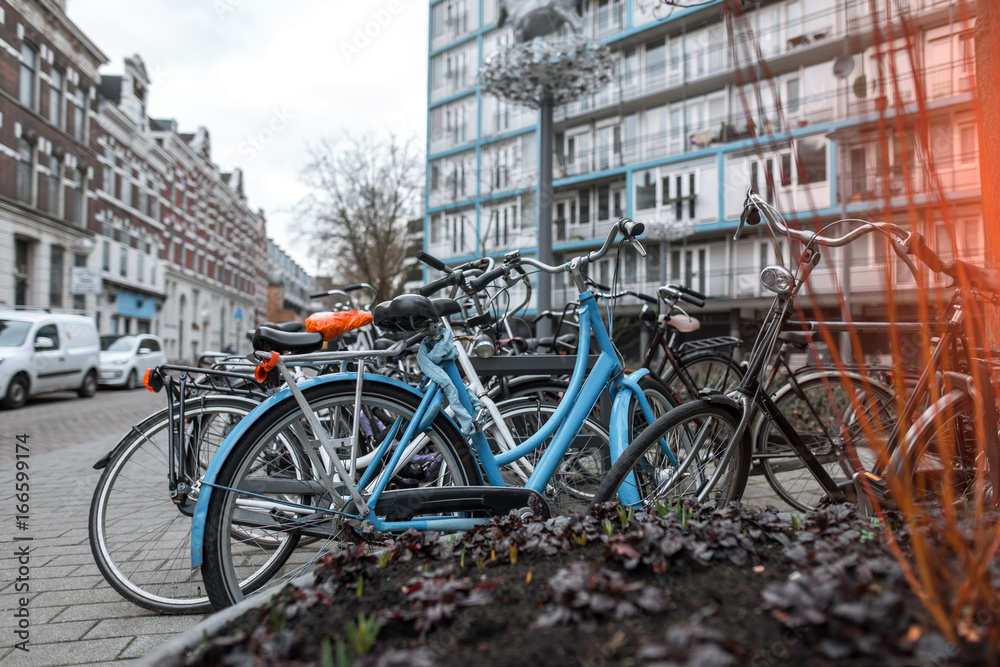Many bicycles parked in a lockable area