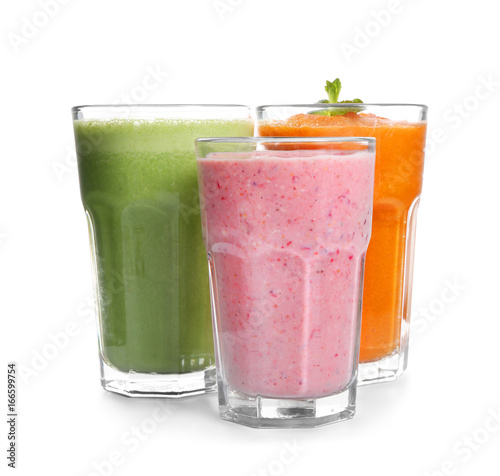 Glasses with fresh tasty smoothies on white background