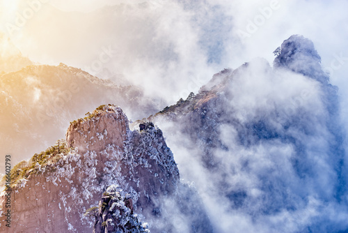 Slika na platnu Sunrise above colorful peaks.