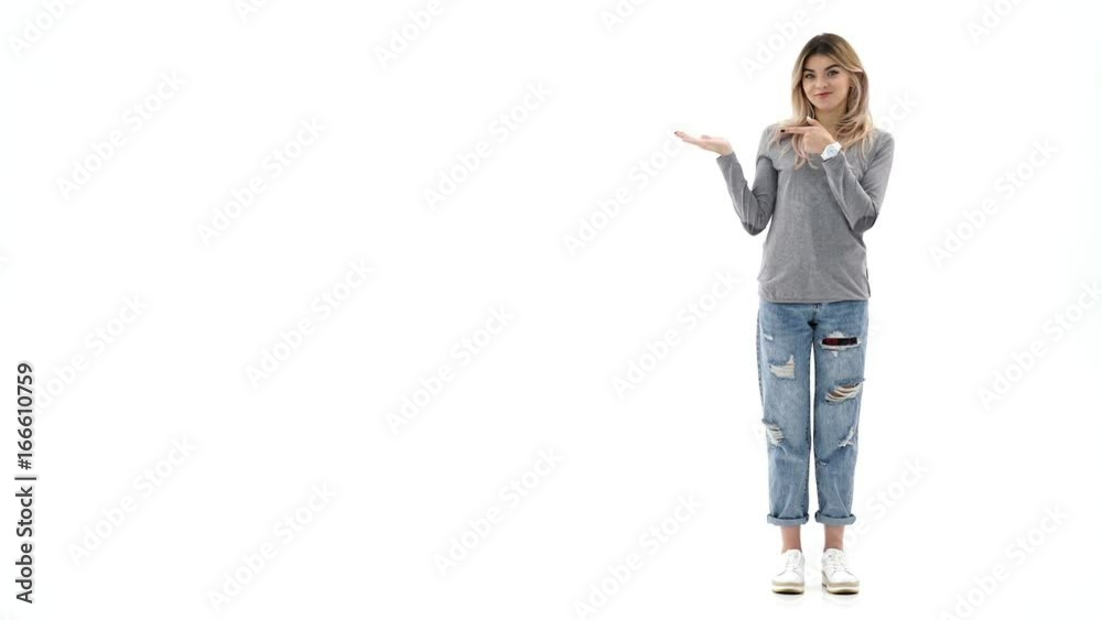 Young smiling caucasian lady isolated over white background near copyspace Young smiling caucasian lady isolated over white background near copyspace