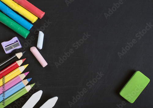 School supplies on blackboard