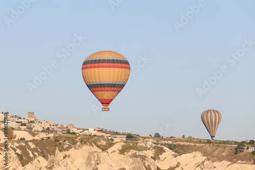 Hot Air Balloons Over Goreme Town © EvrenKalinbacak