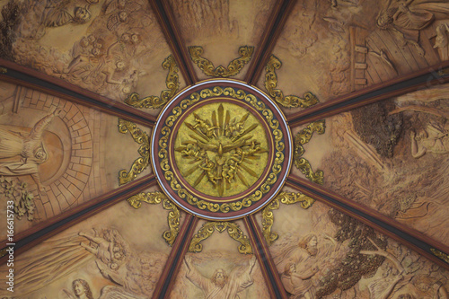 Church dome interior gold painted dove with paintings all around