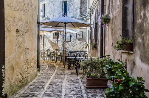 Fototapeta Naklejka Na Ścianę i Meble -  Typical street in the city of erice with its restaurant
