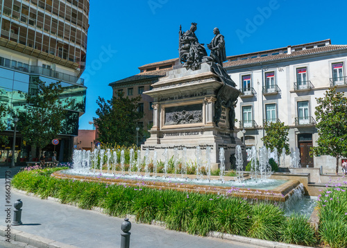 Granada, Spain, juli 1, 2017: Statue and Fountain on Plaza de Carmen photo