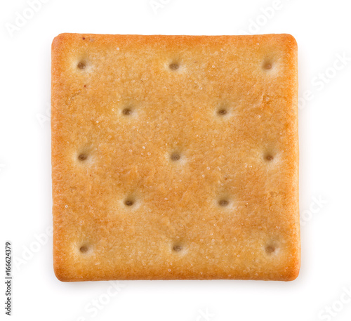 Crispy salted cracker isolated on a white background, top view, close up.