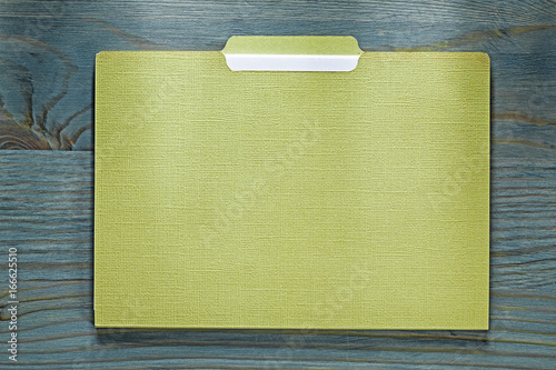 Manila paper folder on wooden board