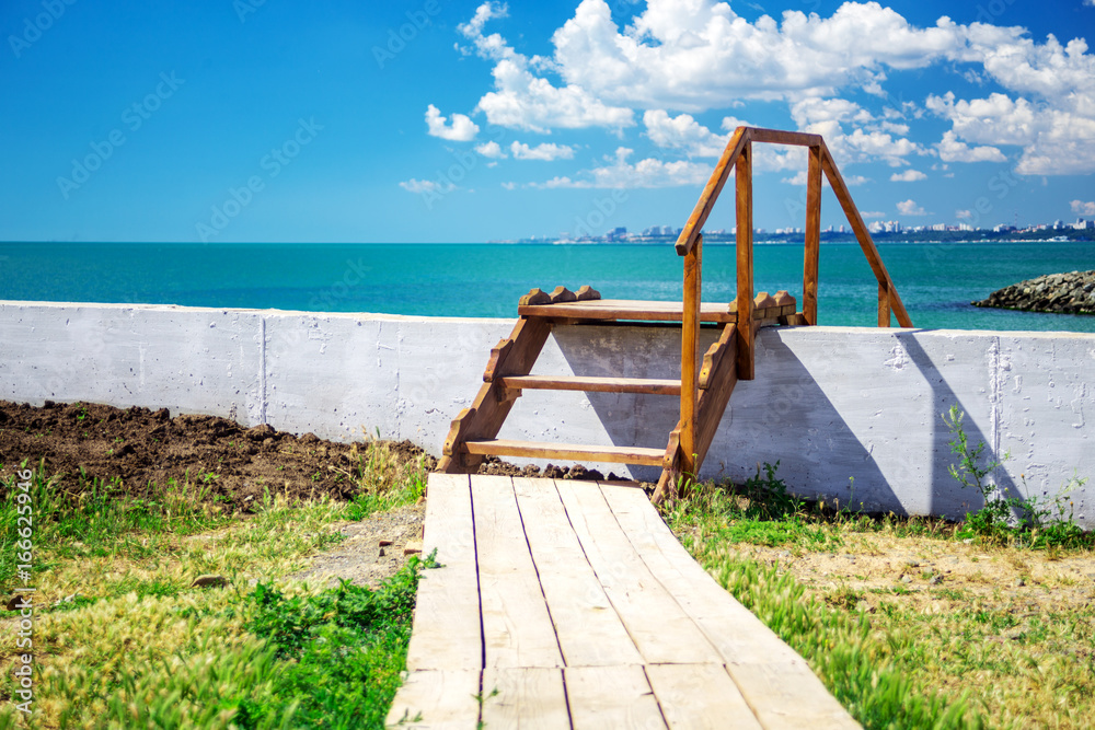 Wooden stairway to beautiful tropical beach. landscape Wooden stairway to beautiful tropical beach. landscape