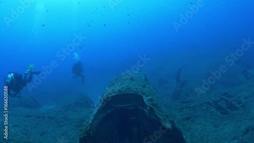 Wallpaper Mural Divers swim over sunken plane, Mediterranean Sea Torontodigital.ca