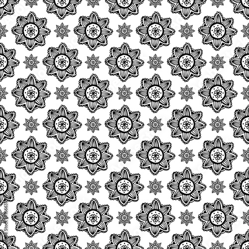 Flower mandala seamless pattern in hand drawn style