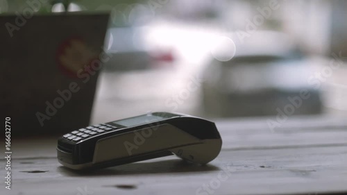 Concept NFC contactless payment. Making payment with credit card and pos terminal, printed check.