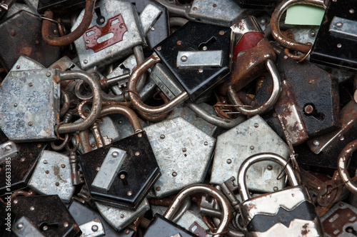 Old rusty locks and keys at flea market. Security, censorship or suppression concept.