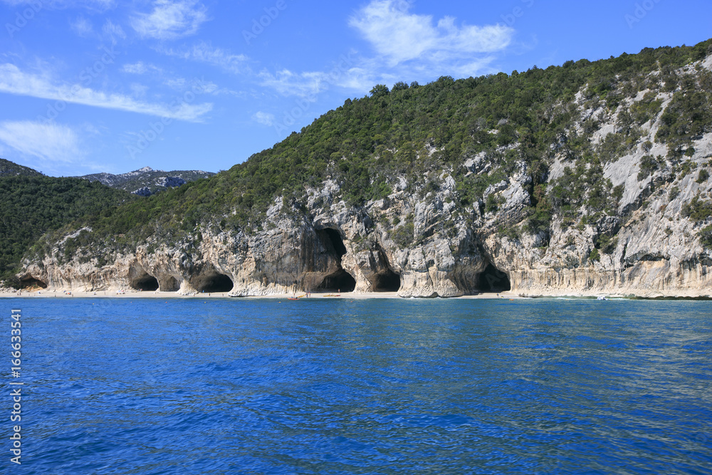 coast of Sardinia . Rocks on the beach