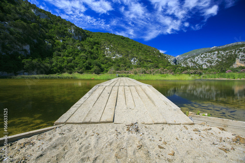 Wooden bridge in a lake © photostocklight