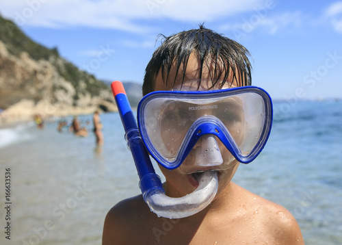 Boy with snorkeling mask © photostocklight