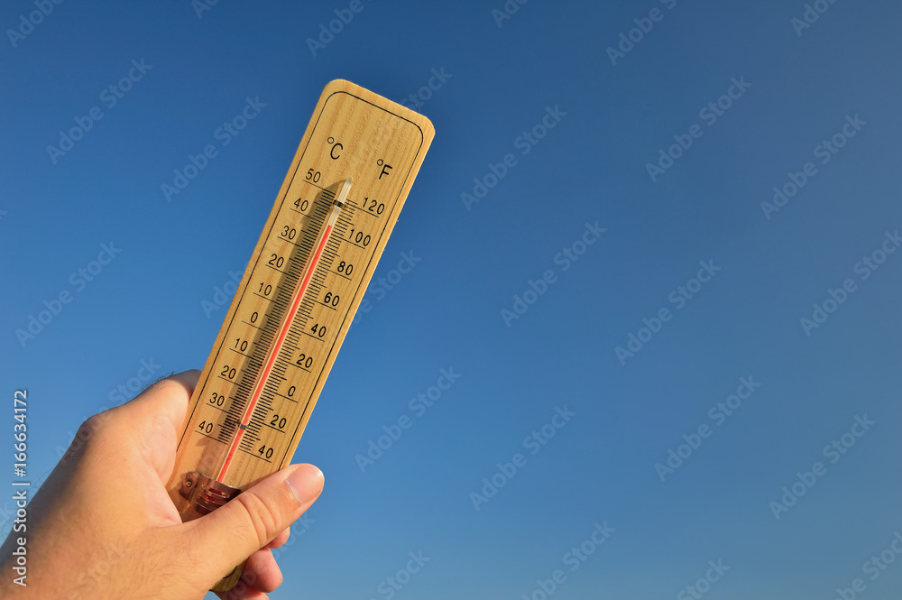Mercury wooden thermometer shows very high temperature. Temperatures in