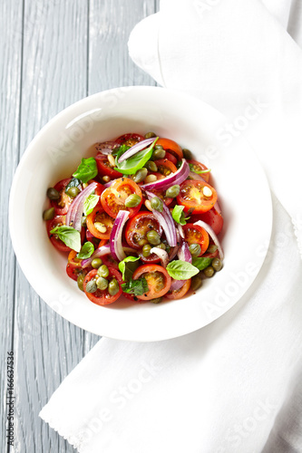 Tomato salad with pine nuts and capers